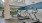 large fitness center with treadmill, tall open ceilings, bright with large windows